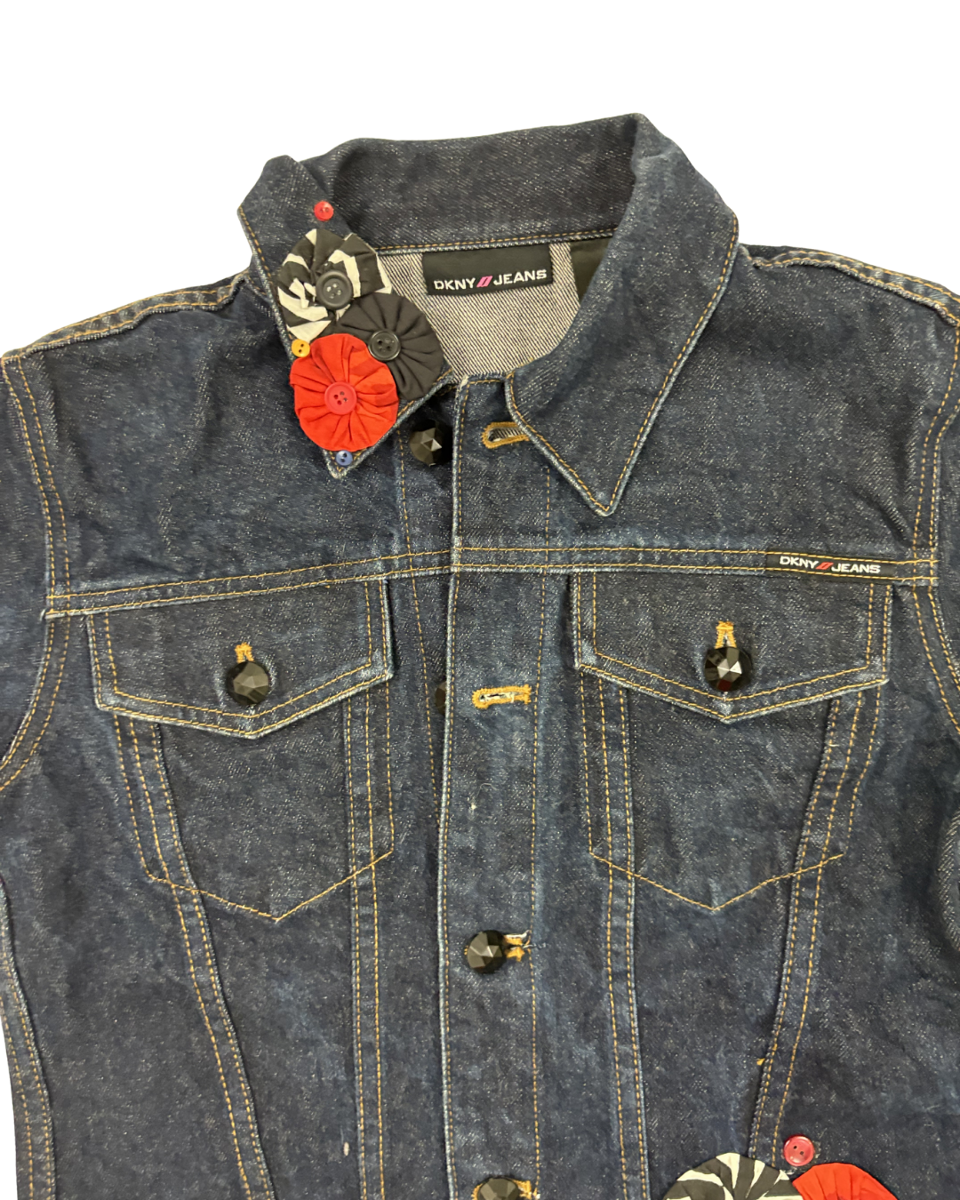 Denim jacket with brand tag on a white background