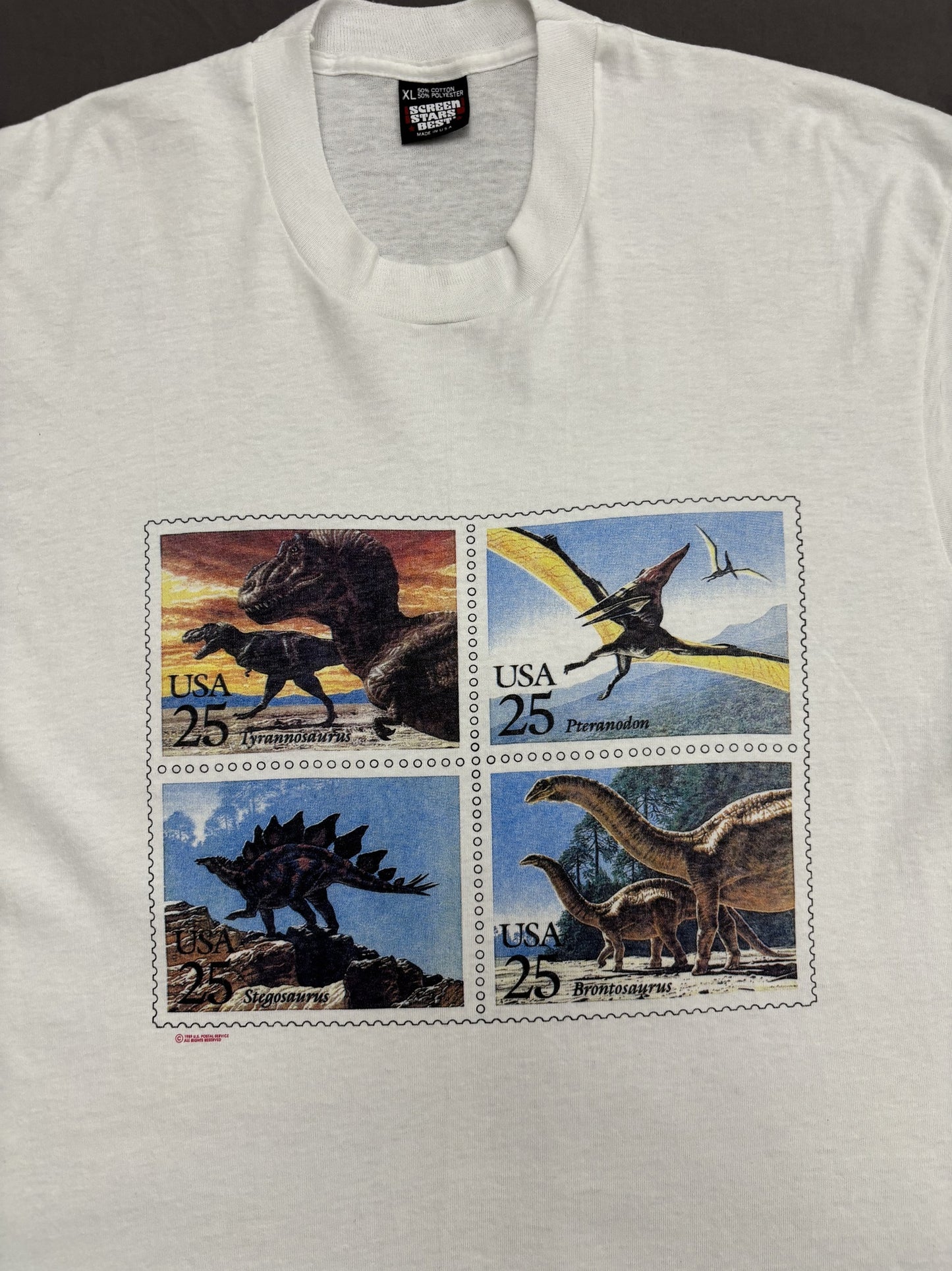 Vintage Made in USA Screen Stars Best Dinosaur Postal Stamp stuff Graphic White T-Shirt - L