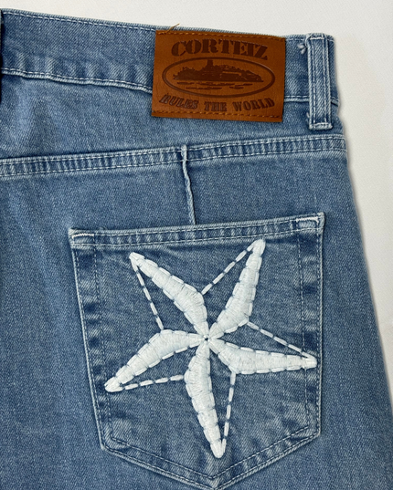 Corteiz Rules The World Light Blue Star Patch Denim Jeans