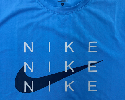 Nike Dri-Fit Blue Graphic Tee – Repeated Logo Print - S