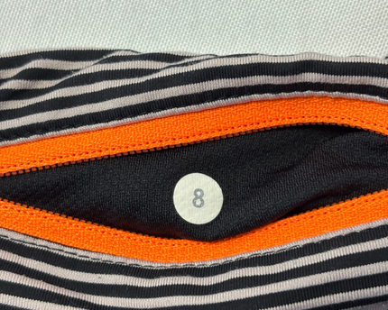Lululemon Black Mixed-Media Performance Leggings with Floral Accents