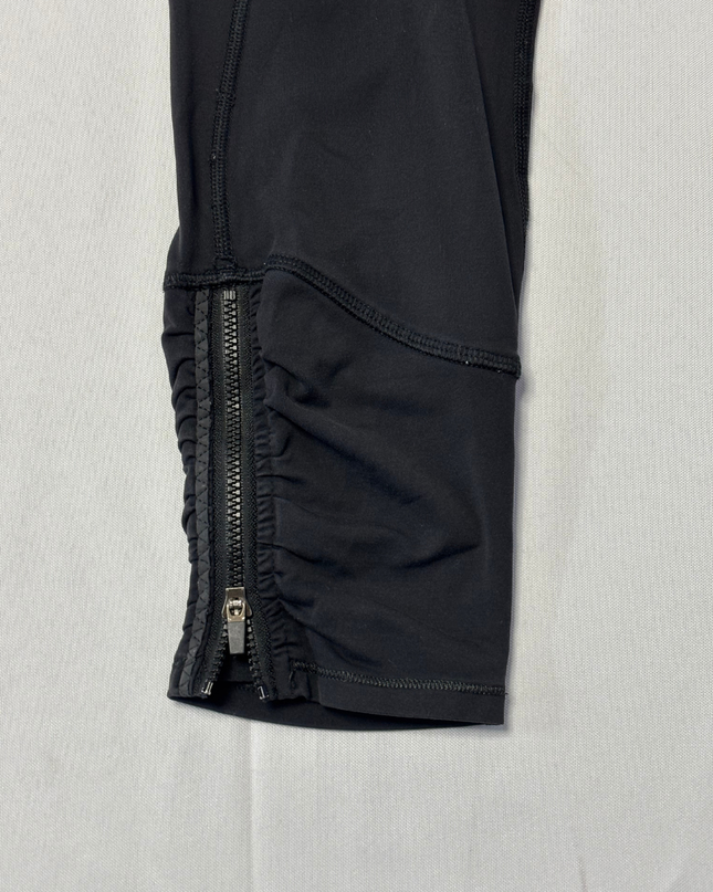 Lululemon Black Activewear Leggings with Floral Waistband and Ruched Zip Detail