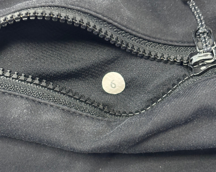 Lululemon Black Activewear Leggings with Floral Waistband and Ruched Zip Detail