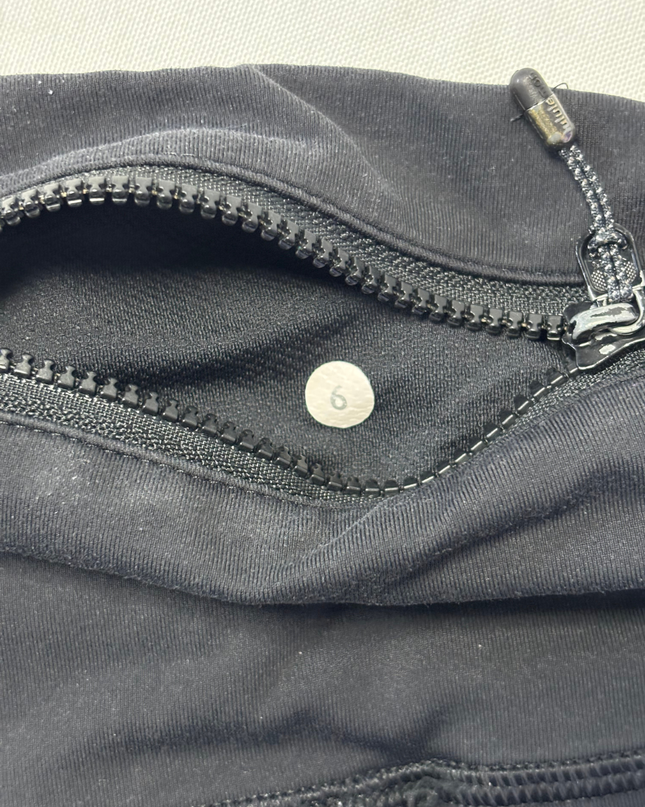 Lululemon Black Activewear Leggings with Floral Waistband and Ruched Zip Detail